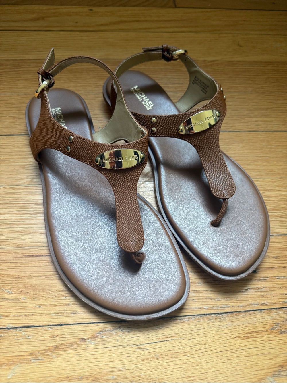 Michael Kors Brown Leather T-Strap Sandals with Gold Plaque